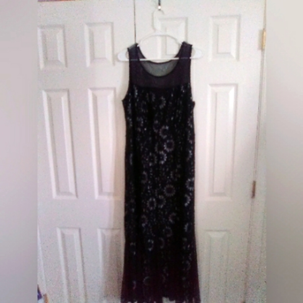 Sleeveless black dress with silver flowers